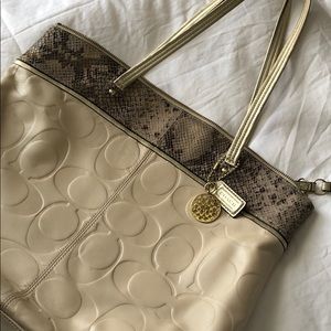 Light Tan/cream and gold leather coach tote.